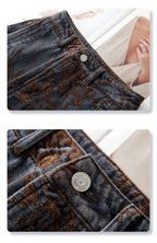 Close-up of Retro Jacquard Wide Leg Denim Pants featuring intricate floral patterns and detailed stitching