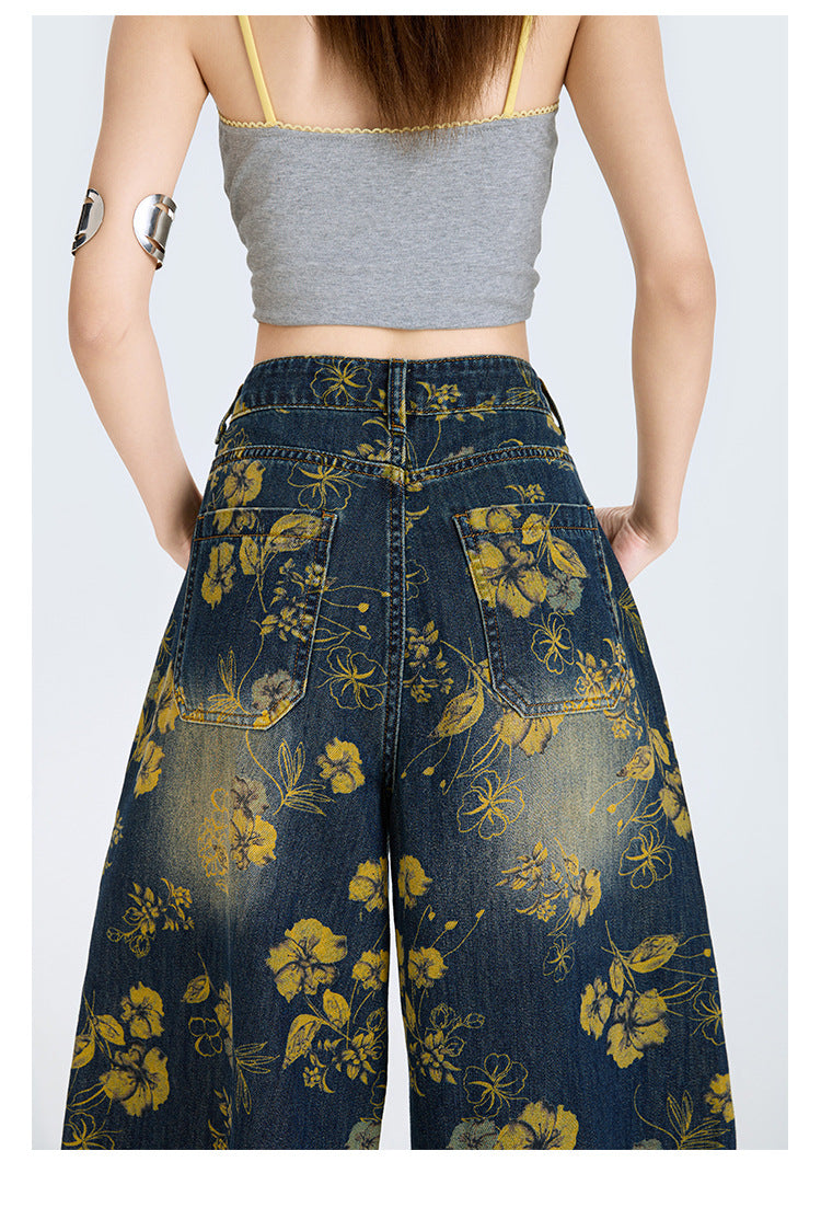 Blugi largi cu print floral din denim inchis talie inalta buzunare spate si croiala evazata