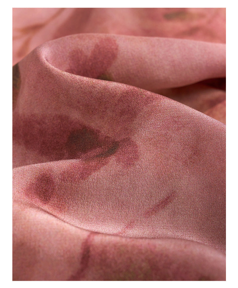 Close-up of Dark Pink Silk Tie Dress fabric showcasing soft texture and floral design