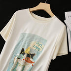 AM Vision RO Cat Comfort Tee featuring a playful cat illustration on a soft, light fabric