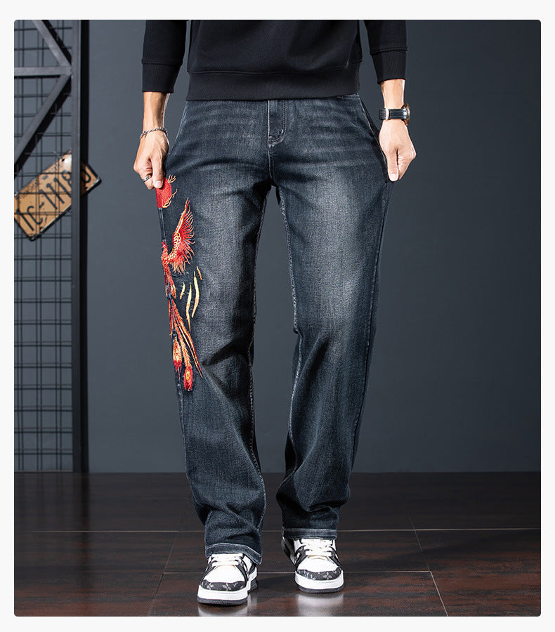 Phoenix Flight Embroidered Jeans featuring a vibrant phoenix design on the leg for a unique style
