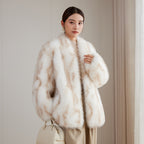 Woman wearing an Apricot Eco Mink Coat, styled with elegant accessories and a handbag