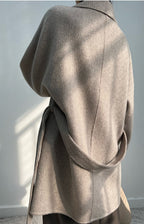 Elegant Adele Double Wool Coat in a soft gray color with a stylish belt detail