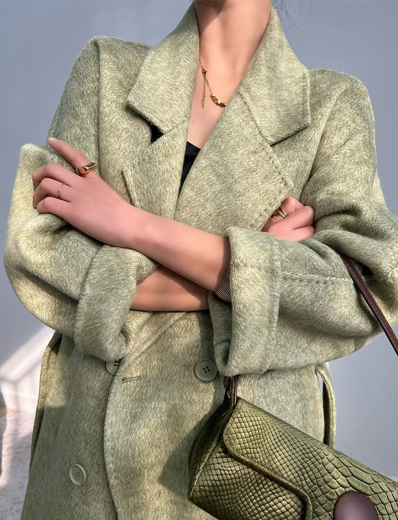 Adele Double Wool Coat in green with oversized lapels and a stylish design for modern fashion