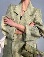 Adele Double Wool Coat in green with oversized lapels and a stylish design for modern fashion