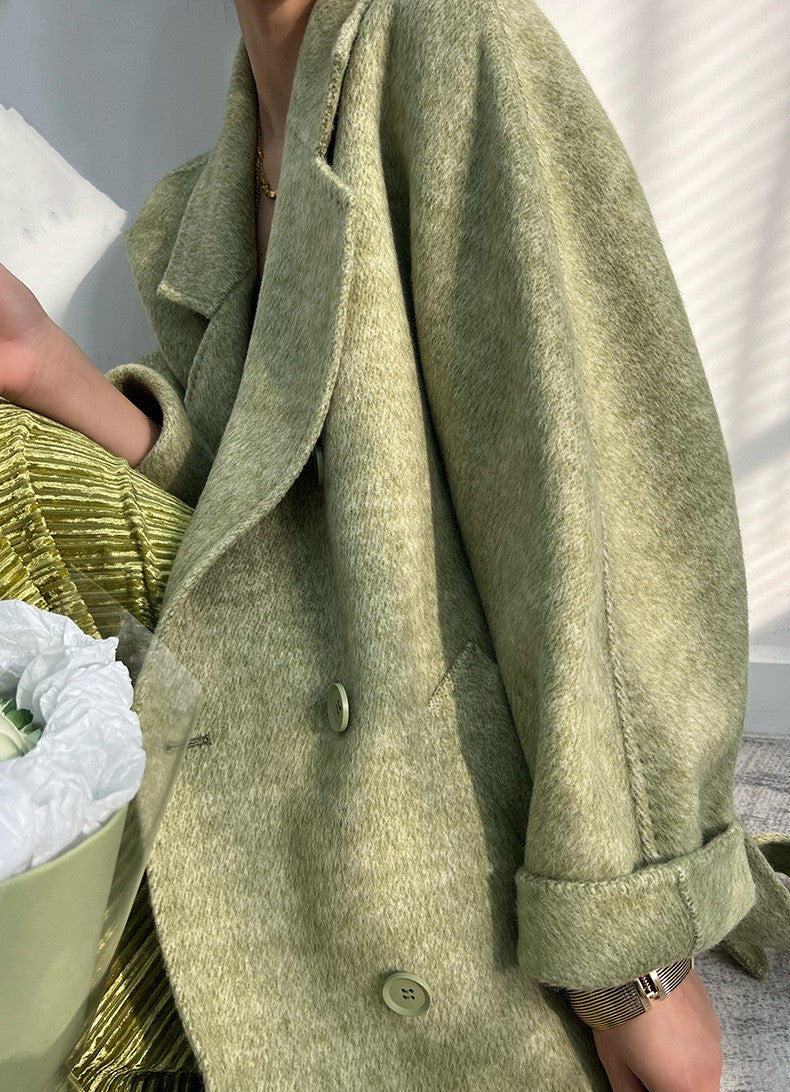 Adele Double Wool Coat in soft green fabric with a stylish oversized fit and double-breasted design