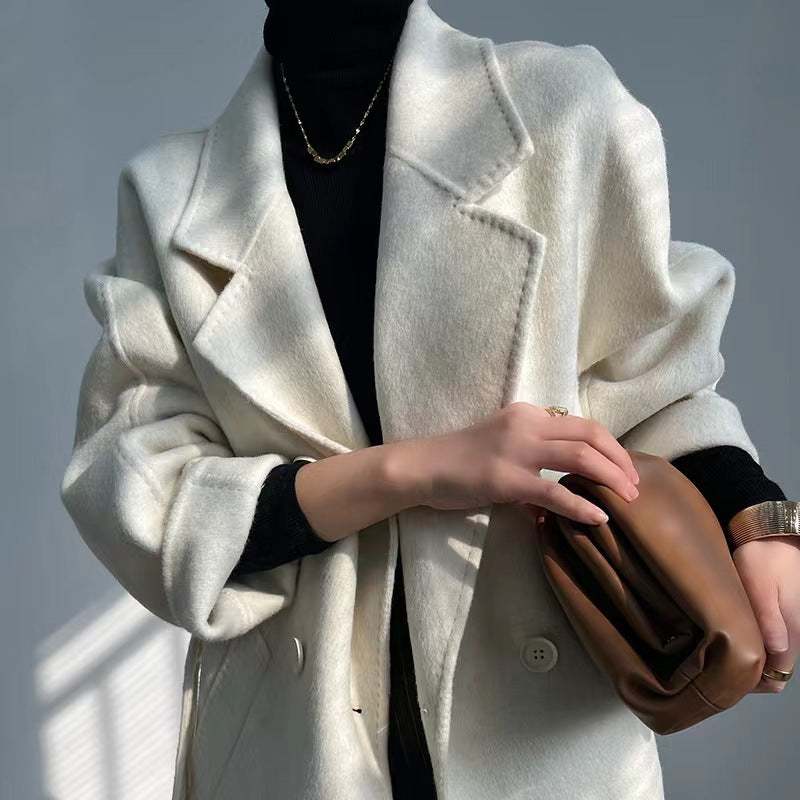 Stylish Adele Double Wool Coat in white, perfect for cold weather layering with elegant design