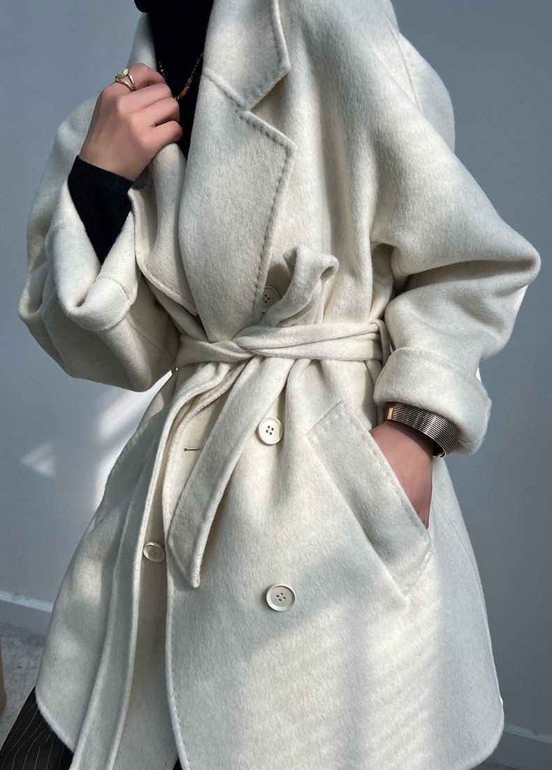 Adele Double Wool Coat in cream with a belt and oversized fit, perfect for stylish winter layering