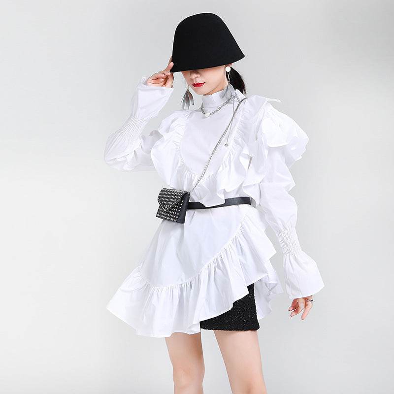 Fashion model showcasing an Asymmetric Dress with Ruffles, styled with accessories and a modern hat