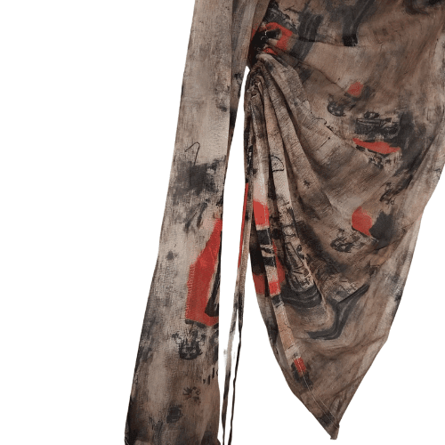 Artistic print on a lightweight asymmetric top featuring a stylish draped design