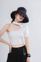 Fashionable Asymmetric Top with Cutouts in white, paired with stylish accessories for a modern look