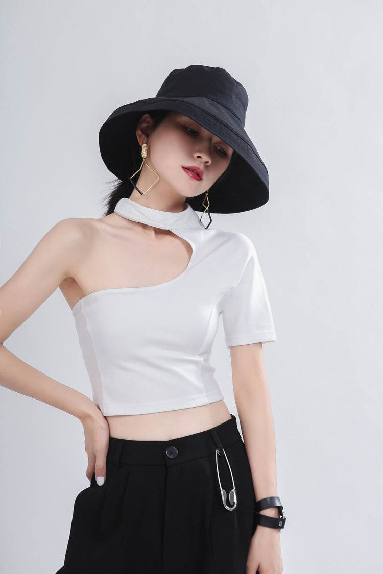 Fashionable Asymmetric Top with Cutouts in white, paired with stylish accessories for a modern look