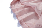Close-up of the interior fabric of the Nude Pink Atelier A-Line Dress showcasing soft material