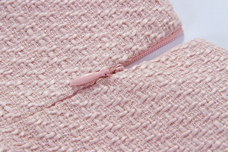 Close-up of Nude Pink Atelier A-Line Dress fabric with intricate texture and zipper detail