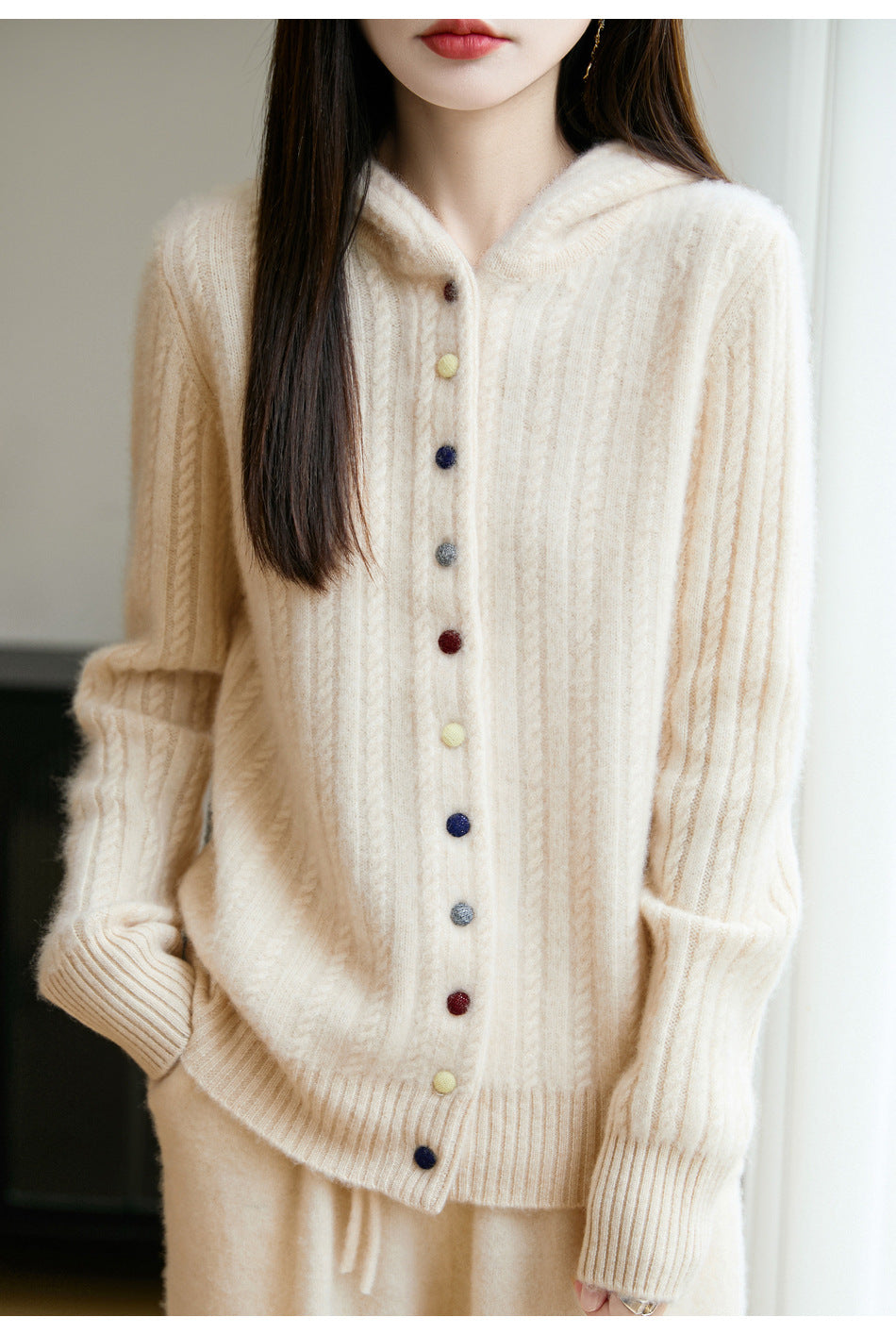 Auriell Wool Hooded Cardigan in beige with colorful buttons and a relaxed fit for cozy layering