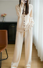 Auriell Wool Hooded Cardigan in cream color paired with matching cozy pants for casual lounging
