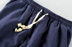 Close-up of AM Vision RO Autumn Linen Pants featuring a drawstring waist and soft fabric