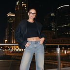 Stylish model wearing Autumn Sparkling 3D Rhinestone Straight-Leg Jeans with a black top and jacket at night