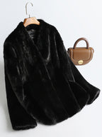 Aveline Noir Mink Coat in black, featuring a plush texture and elegant design, perfect for winter fashion.