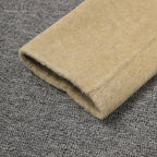 Close-up of a Beige Wool Coat With Wrap Belt, Soft Texture highlighting the fabric quality and craftsmanship