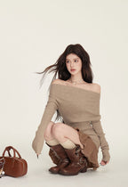 Chic model wearing a cozy Black Knitted Sweater Dress With Spliced Skirt styled with brown boots