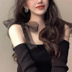 Stylish black strap blouse for women with sheer bow details and off-shoulder design