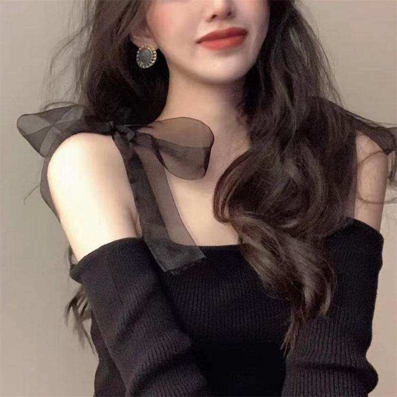 Stylish black strap blouse for women with sheer bow details and off-shoulder design