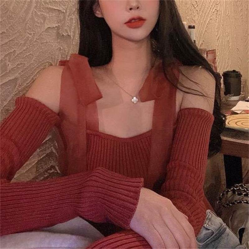 Stylish black strap blouse for women featuring a trendy design with long ribbed sleeves