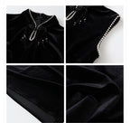 Elegant black velvet dress with beads highlighting a stylish neckline and fine detailing