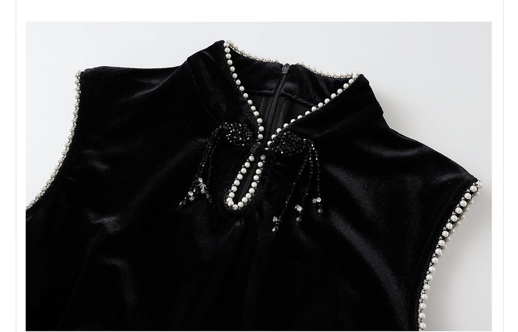 Elegant black velvet dress with beads featuring a high neckline and detailed embellishments