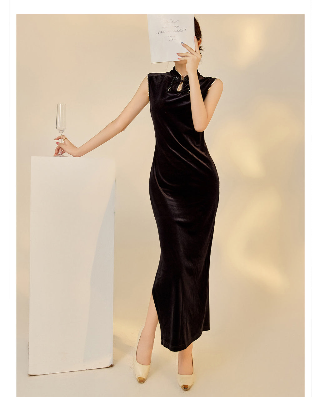 Elegant black velvet dress with beads featuring a sleek design and high slit for sophisticated style