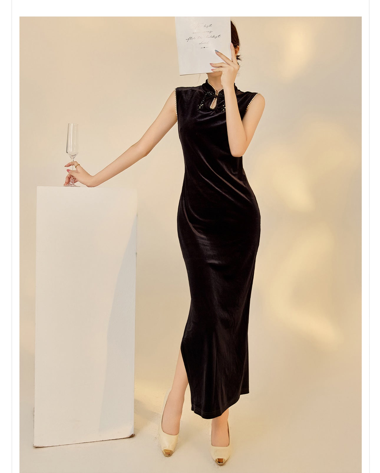 Elegant black velvet dress with beads featuring a sleek design and high slit for sophisticated style