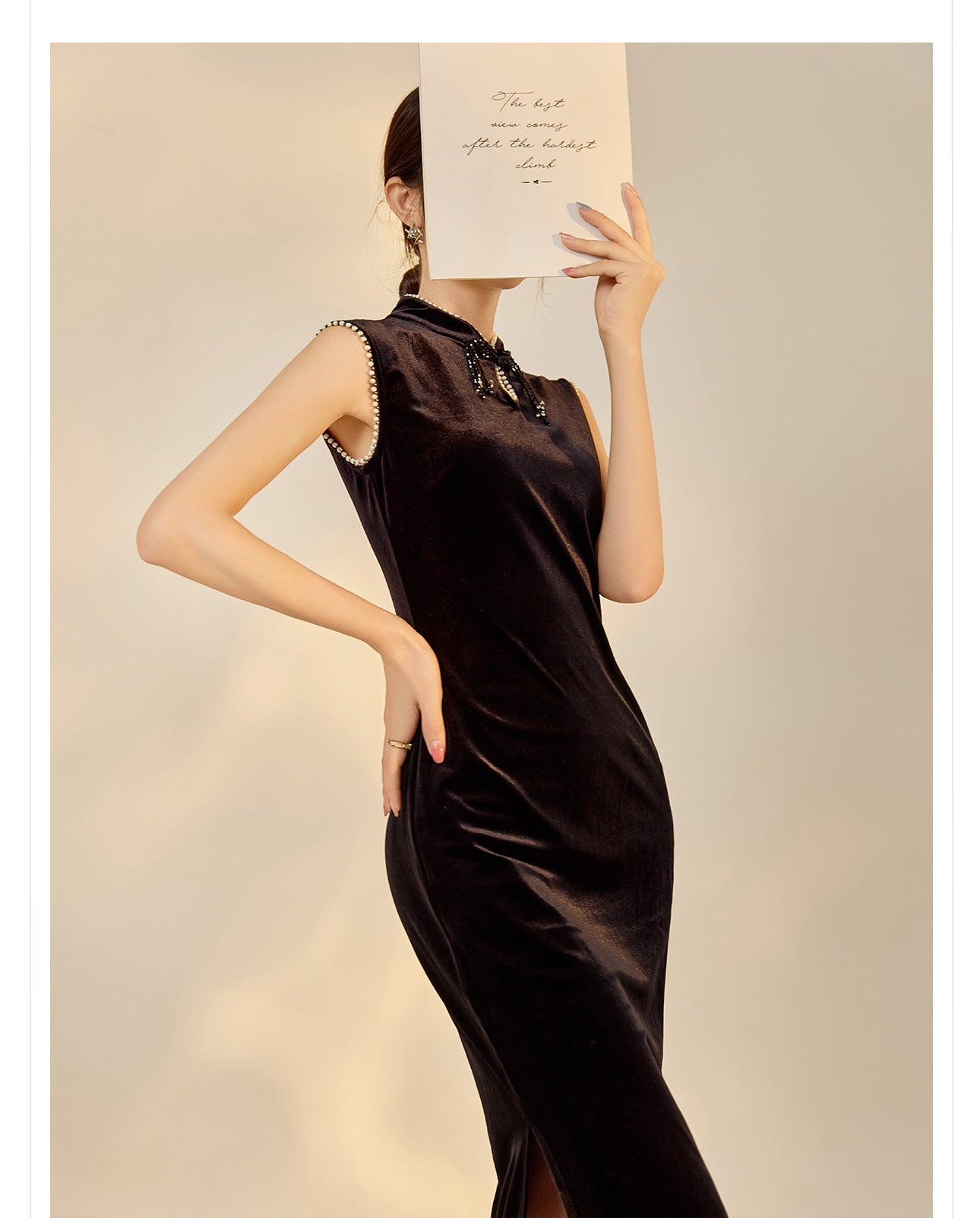 Elegant black velvet dress with beads featuring a chic high neckline and a sleek silhouette