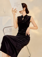 Elegant model showcasing a black velvet dress with beads, styled for a chic evening look