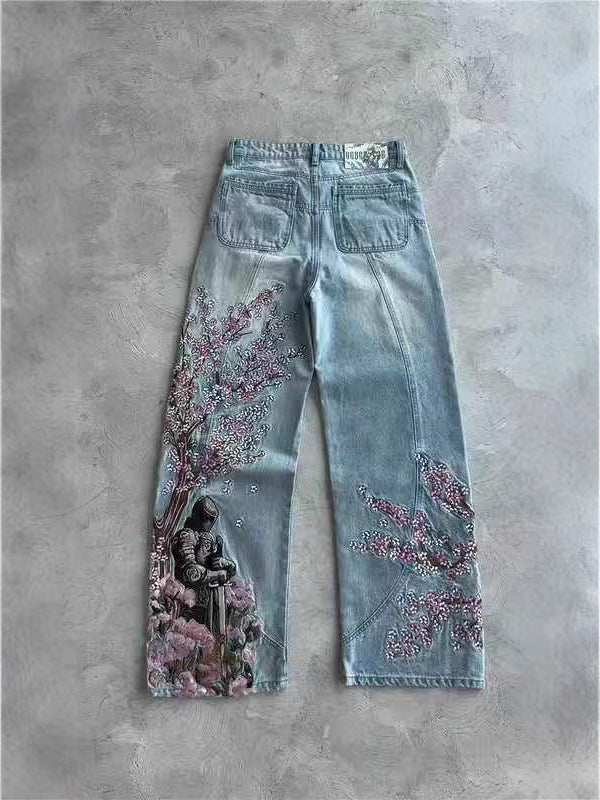 Bloom Drift Wide Leg Jeans featuring floral embroidery and a unique design on a light blue background