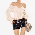 Stylish Blouse with Corset and Bare Shoulders, featuring lace-up detail and puffed sleeves
