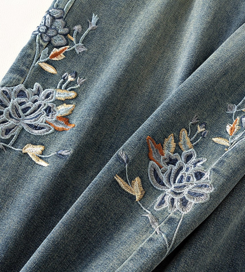 Close-up of Blue Lotus Retro Embroidered Jeans featuring intricate floral embroidery details on denim fabric
