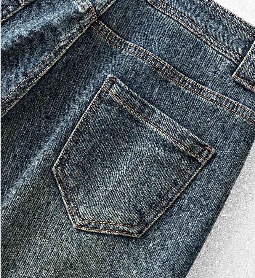 Close-up of Blue Lotus Retro Embroidered Jeans showcasing detailed back pocket design