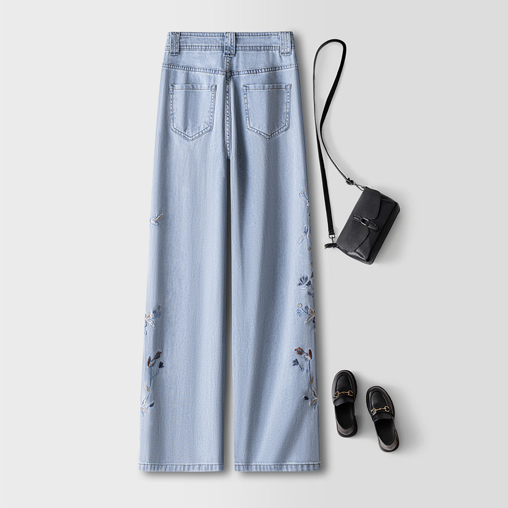 Blue Lotus Retro Embroidered Jeans in light blue with floral details and casual accessories