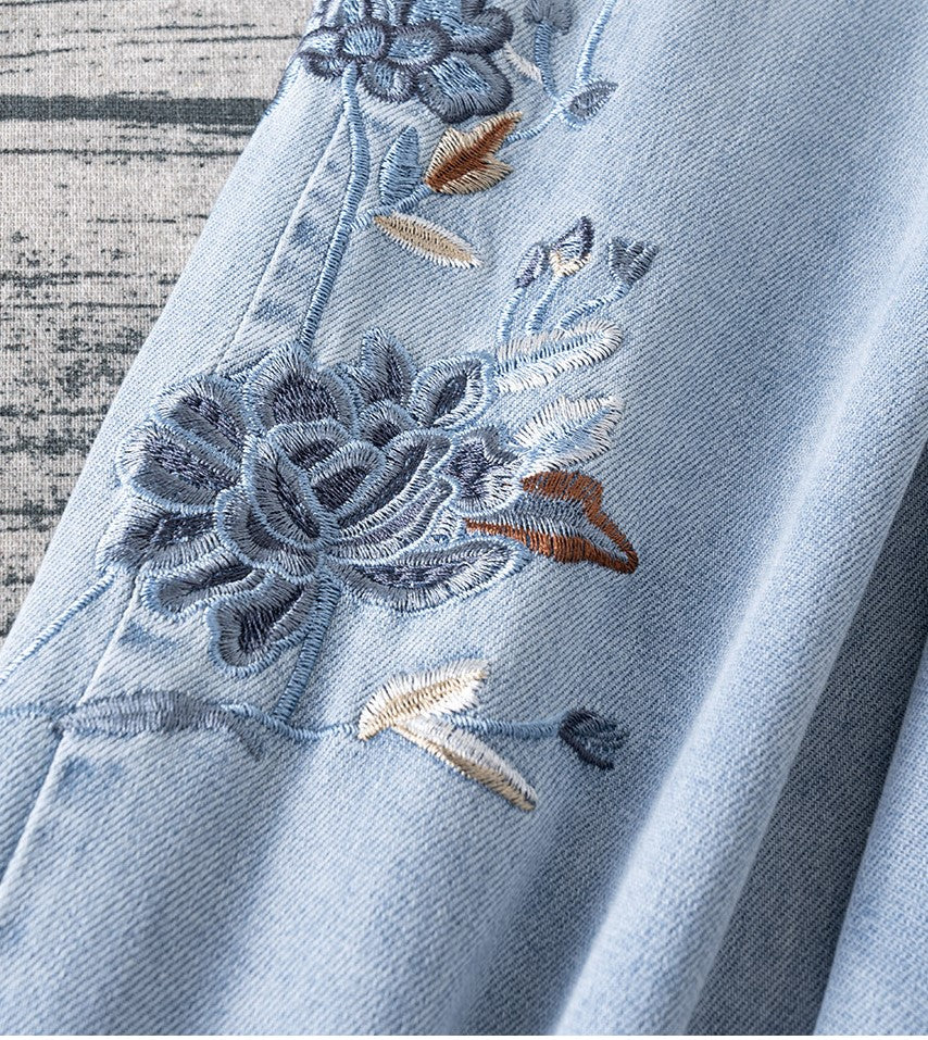 Close-up of Blue Lotus Retro Embroidered Jeans showcasing detailed floral embroidery design