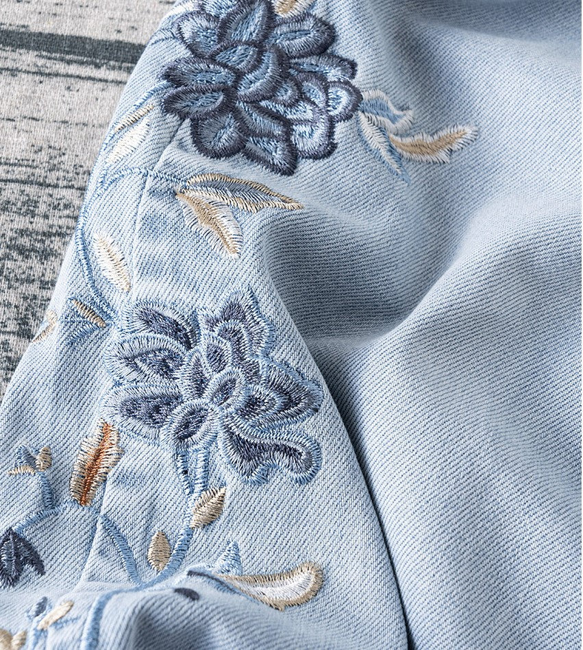 Close-up of Blue Lotus Retro Embroidered Jeans showcasing intricate floral embroidery details