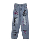 Blue Rebel Ripped Street Jeans with Graffiti Designs and Distressed Details for a Trendy Look