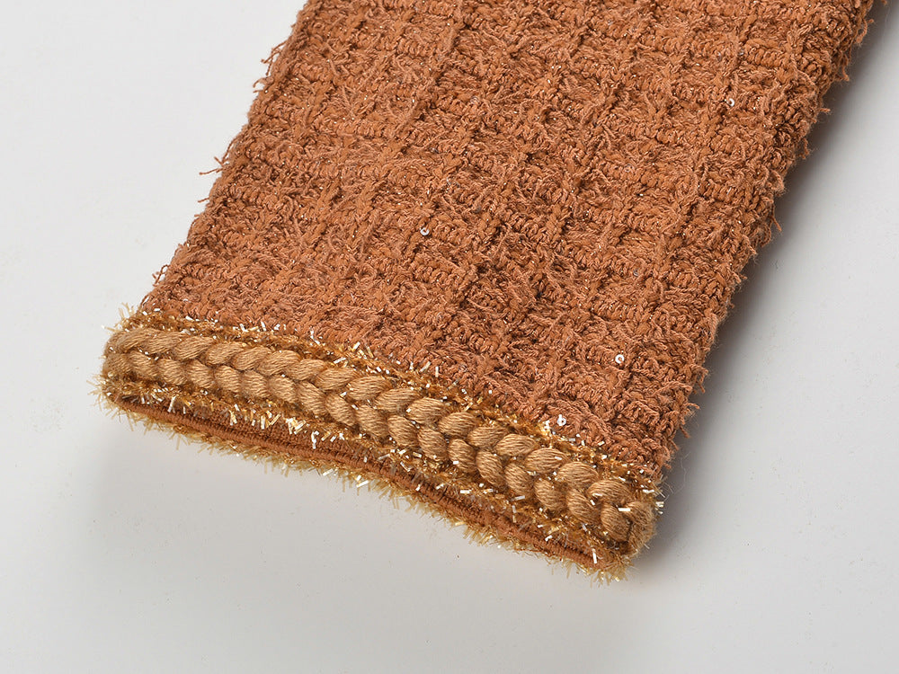 Close-up of the fabric texture on a Camille Knit Dress Wool Elegance showcasing its rich color and detail