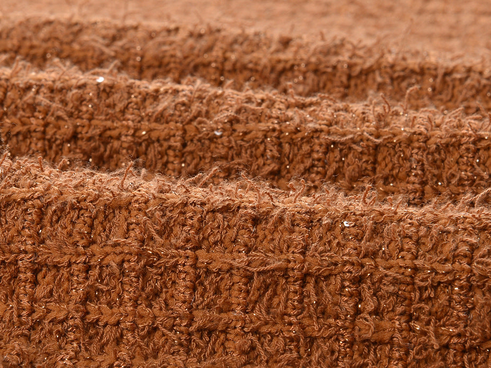 Close-up of Camille Knit Dress Wool Elegance fabric in rich brown texture with intricate knit pattern