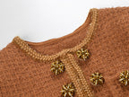 Close-up of Camille Knit Dress Wool Elegance showing textured fabric and decorative bead details