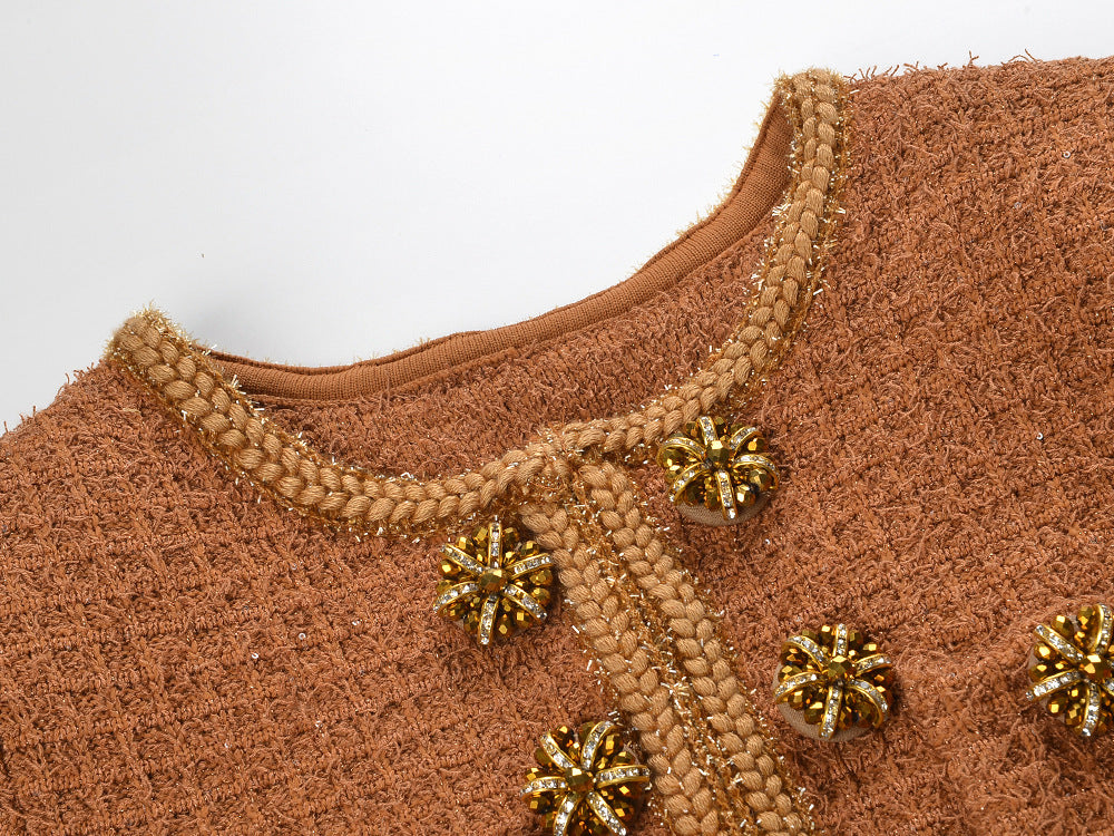 Close-up of Camille Knit Dress Wool Elegance showing textured fabric and decorative bead details