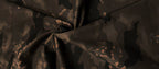 Close-up of Camouflage Flare Pants fabric featuring a dark, abstract pattern for a stylish look