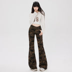 Stylish model wearing Camouflage Flare Pants paired with a cropped white hoodie