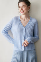 Light blue AM Vision RO cashmere lace cardigan with ribbed texture and button closure