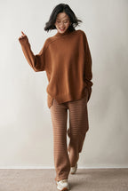 Cozy AM Vision RO cashmere turtleneck sweater for women in warm brown paired with striped pants